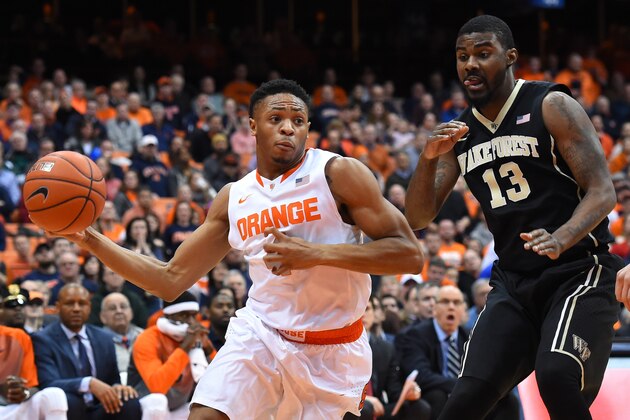 SYRACUSE, NY - JANUARY 13:  Ron Patterson #4 of the Syracuse Orange looks to pass the ball around the defense of Darius Leonard #13 of the Wake Forest Demon Deacons during the second half at the Carrier Dome on January 13, 2015 in Syracuse, New York.  Syracuse defeated Wake Forest 86-83 in overtime.  (Photo by Rich Barnes/Getty Images)