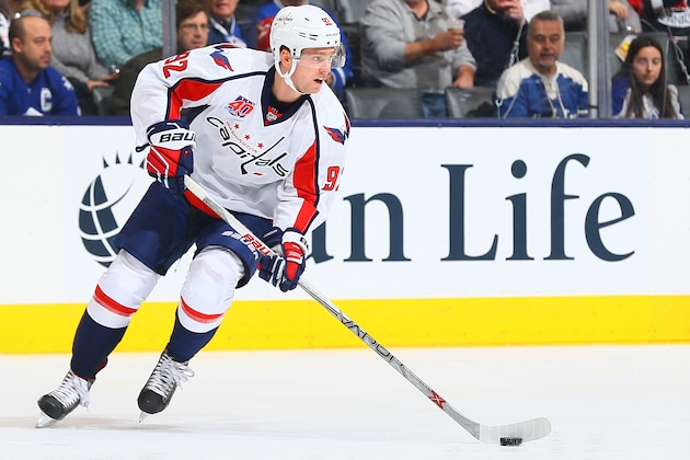 TORONTO, ON - JANUARY 7: Evgeny Kuznetsov #92 of the Washington Capitals carries the puck during game action against the Toronto Maple Leafs on January 7, 2015 at Air Canada Centre in Toronto, Ontario, Canada. (Photo by Graig Abel/NHLI  via Getty Images)