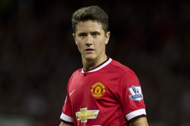 Manchester United's Ander Herrera waits for a corner during his team's pre season friendly soccer match against Valencia at Old Trafford Stadium, Manchester, England, Tuesday Aug. 12, 2014. (AP Photo/Jon Super)
