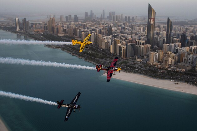 ABU DHABI, UAE - FEBRUARY 10:  In this handout from Red Bull, American Kirby Chambliss, Pete McLeod of Canada and Francois Le Vot of France fly during an aerial inspection of the nearby race track in preparation for the first stop of the 2015 Red Bull Air Race World Championship, February 10, 2015 in Abu Dhabi, the Untied Arab Emirates. The Championship takes place this weekend. (Photo by Joerg Mitter/Red Bull via Getty Images)