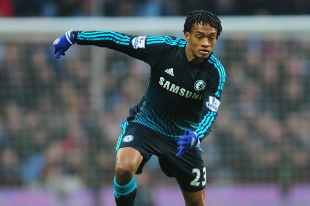 Chelsea's Juan Cuadrado controls the ball in his first game during the English Premier League soccer match between Aston Villa and Chelsea at Villa Park, Birmingham, England, Saturday, Feb 7, 2015. (AP Photo/Rui Vieira)