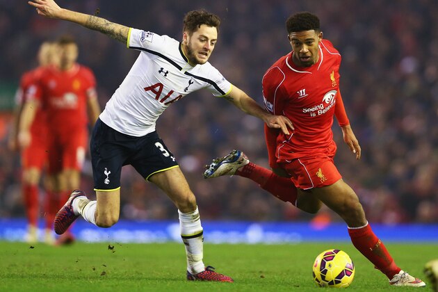 LIVERPOOL, ENGLAND - FEBRUARY 10: Jordon Ibe of Liverpool takes on Ryan Mason of Tottenham Hotspur during the Barclays Premier League match between Liverpool and Tottenham Hotspur at Anfield on February 10, 2015 in Liverpool, England.  (Photo by Clive Brunskill/Getty Images)