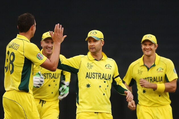 MELBOURNE, AUSTRALIA - FEBRUARY 11:  Josh Hazlewood of Australia (L) celebrates a wicket with Michael Clarke (C) during the Cricket World Cup warm up match between Australia and the United Arab Emirates at Melbourne Cricket Ground on February 11, 2015 in Melbourne, Australia.  (Photo by Michael Dodge/Getty Images)