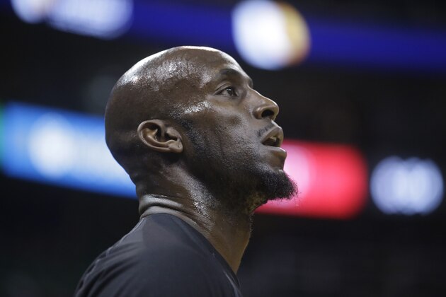 Brooklyn Nets forward Kevin Garnett looks on before the start of their NBA basketball game against the Utah Jazz Saturday, Jan. 24, 2015, in Salt Lake City. (AP Photo/Rick Bowmer)