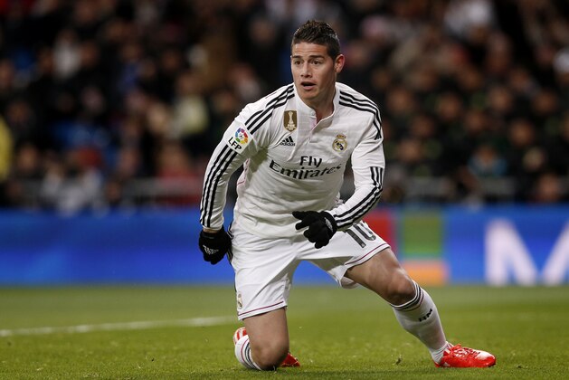James Rodriguez from Colombia celebrates after scoring a goal during a Spanish La Liga soccer match between Real Madrid and Sevilla at the Santiago Bernabeu stadium in Madrid, Spain, Wednesday, Feb. 4, 2015. (AP Photo/Daniel Ochoa de Olza)