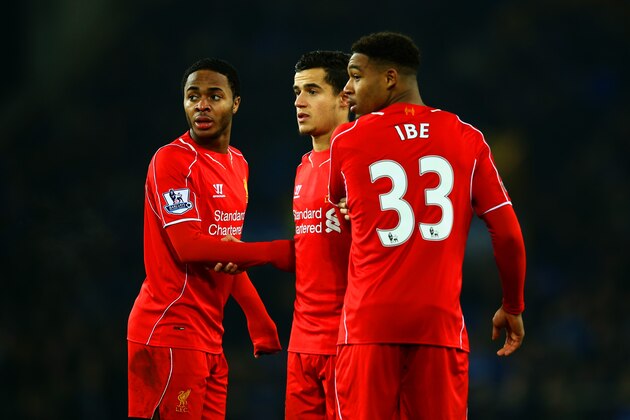 LIVERPOOL, ENGLAND - FEBRUARY 07:  (L-R) Raheem Sterling, Philippe Coutinho and Jordon Ibe of Liverpool line up a wall during the Barclays Premier League match between Everton and Liverpool at Goodison Park on February 7, 2015 in Liverpool, England.  (Photo by Richard Heathcote/Getty Images)