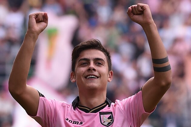 PALERMO, ITALY - NOVEMBER 30:Paulo Dybala of Palermo celebrates after scoring the opening goal during the Serie A match between US Citta di Palermo and Parma FC at Stadio Renzo Barbera on November 30, 2014 in Palermo, Italy.  (Photo by Tullio M. Puglia/Getty Images)
