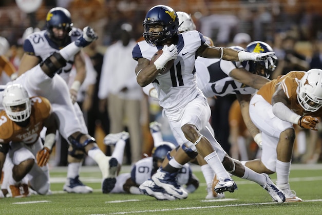 West Virginia’s Kevin White (11) runs after making a reception against Texas during the second half of an NCAA college football game, Saturday, Nov. 8, 2014, in Austin, Texas.  Texas won 33-16. (AP Photo/Eric Gay)