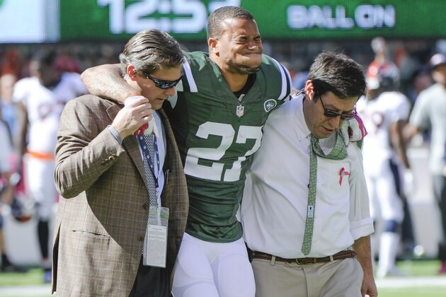 New York Jets cornerback Dee Milliner (27) is helped off the field with an ankle injury against the Denver Broncos in the first quarter of an NFL football game, Sunday, Oct. 12, 2014, in East Rutherford, N.J. (AP Photo/Bill Kostroun)