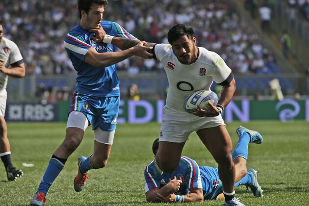 England's Manusamoa Tulagi, right, scores as Leonardo Sarto, left, tries to stop him during a Six Nations international rugby union match between Italy and England, in Rome, Saturday, March 15, 2014. (AP Photo/Alessandra Tarantino)