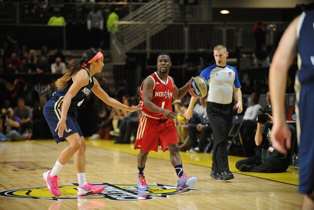 NEW ORLEANS, LA - FEBRUARY 14: Comedian Kevin Hart #1 of the West team dribbles against WNBA Player Skylar Diggins #4 of the East team during the Sprint NBA All-Star Celebrity Game at Sprint Arena as part of 2014 NBA All-Star Jam Session at the Ernest N. Morial Convention Center on February 14, 2014 in New Orleans, Louisiana. NOTE TO USER: User expressly acknowledges and agrees that, by downloading and/or using this photograph, user is consenting to the terms and conditions of the Getty Images License Agreement.  Mandatory Copyright Notice: Copyright 2014 NBAE (Photo by Juan O'Campo/NBAE via Getty Images)