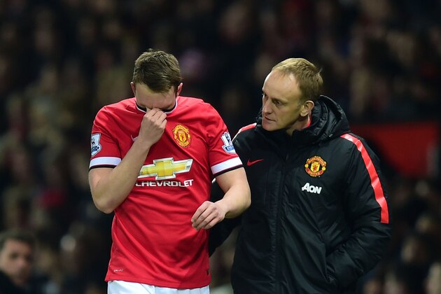MANCHESTER, ENGLAND - FEBRUARY 11:  Phil Jones of Manchester United leaves the field injured during the Barclays Premier League match between Manchester United and Burnley at Old Trafford on February 11, 2015 in Manchester, England.  (Photo by Jamie McDonald/Getty Images)
