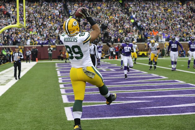 Green Bay Packers tight end Richard Rodgers catches a 1-yard touchdown pass during the first half of an NFL football game against the Minnesota Vikings, Sunday, Nov. 23, 2014, in Minneapolis. (AP Photo/Ann Heisenfelt)