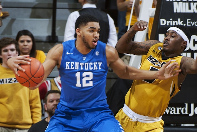 Kentucky's Karl-Anthony Towns, left, pushes past Missouri's D'Angelo Allen on a drive to the basket during the first half of an NCAA college basketball game Thursday, Jan. 29, 2015, in Columbia, Mo. (AP Photo/L.G. Patterson)