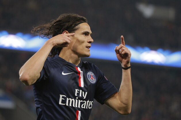 PSG's Edinson Cavani scores the opening goal during the Champions League Group F soccer match between Paris Saint Germain and Ajax at Parc des Princes stadium in Paris, France, Tuesday, Nov. 25, 2014. (AP Photo/Francois Mori)