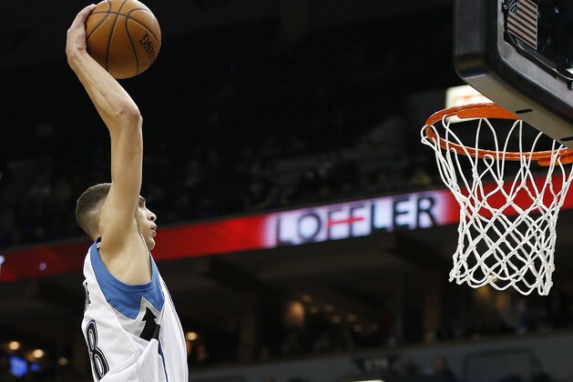 Minnesota Timberwolves guard Zach LaVine (8) takes the ball to the hoop against the Golden State Warriors during the first half of an NBA basketball game Monday, Dec, 8, 2014, in Minneapolis. (AP Photo/Stacy Bengs)