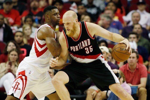 HOUSTON, TX - FEBRUARY 08:   Chris Kaman #35 of the Portland Trail Blazers drives with the ball against Terrence Jones #6 of the Houston Rockets during their game at the Toyota Center on February 8, 2015 in Houston, Texas. NOTE TO USER: User expressly acknowledges and agrees that, by downloading and/or using this photograph, user is consenting to the terms and conditions of the Getty Images License Agreement.  (Photo by Scott Halleran/Getty Images)