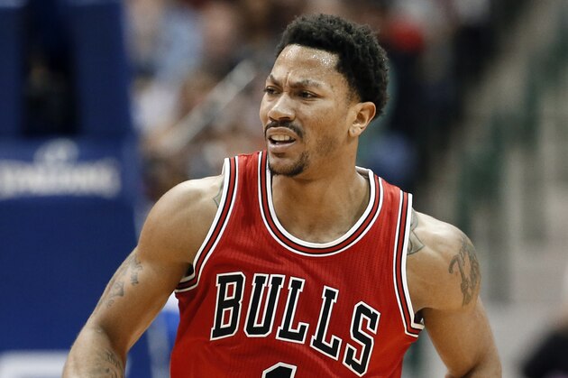 Chicago Bulls' Derrick Rose (1) runs up court after sinking a basket in the second half of an NBA basketball game against the Dallas Mavericks, Friday, Jan. 23, 2015, in Dallas. (AP Photo/Tony Gutierrez)