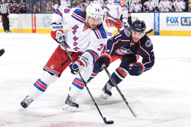 COLUMBUS, OH - JANUARY 16: Nick Foligno #71 of the Columbus Blue Jackets attempts to knock the puck away from Mats Zuccarello #36 of the New York Rangers during the second period on January 16, 2015 at Nationwide Arena in Columbus, Ohio.  (Photo by Jamie Sabau/NHLI via Getty Images)