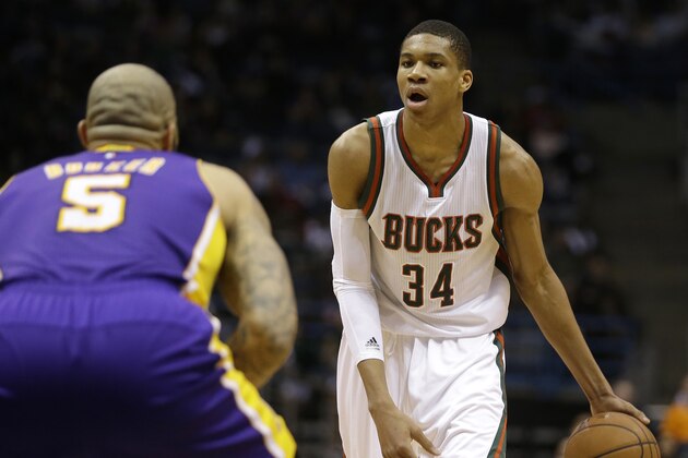 Milwaukee Bucks' Giannis Antetokounmpo dribbles against Los Angeles Lakers' Carlos Boozer during an NBA basketball game Wednesday, Feb. 4, 2015, in Milwaukee. (AP Photo/Aaron Gash)