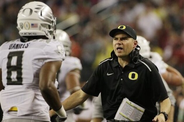Oregon head coach Mark Helfrich in action during the first half of the NCAA college football playoff championship game against Ohio State Monday, Jan. 12, 2015, in Arlington, Texas. (AP Photo/David J. Phillip)