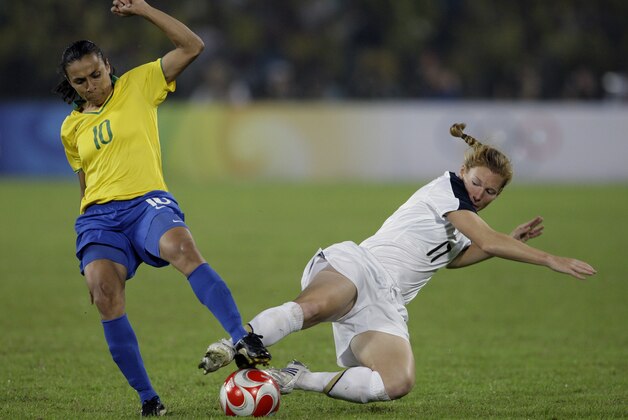 Brazil's Marta and United States' Lori Chalupny fight for the ball during their women's soccer gold medal match at the Beijing 2008 Olympics in China Thursday, Aug. 21, 2008. (AP Photo/Petr David Josek)