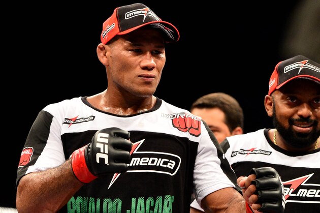 Feb 15, 2014; Jaragua do Sul, SC, Brazil; Ronaldo Souza (red gloves) after defeating Francis Carmont (blue gloves) during UFC Fight Night Machida vs Mousasi at Arena Jaragua. Mandatory Credit: Jason Silva-USA TODAY Sports
