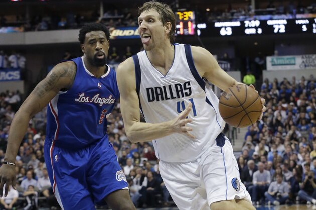Dallas Mavericks forward Dirk Nowitzki (41) drives past Los Angeles Clippers center DeAndre Jordan (6) during the second half of an NBA basketball game Monday, Feb. 9, 2015, in Dallas. The Clippers won 115-98.  (AP Photo/LM Otero)