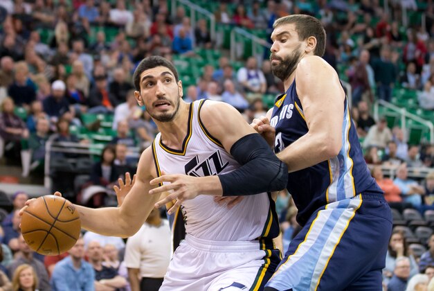 Feb 4, 2015; Salt Lake City, UT, USA; Utah Jazz center Enes Kanter (0) dribbles the ball as Memphis Grizzlies center Marc Gasol (33) defends during the second half at EnergySolutions Arena. Memphis won 100-90. Mandatory Credit: Russ Isabella-USA TODAY Sports