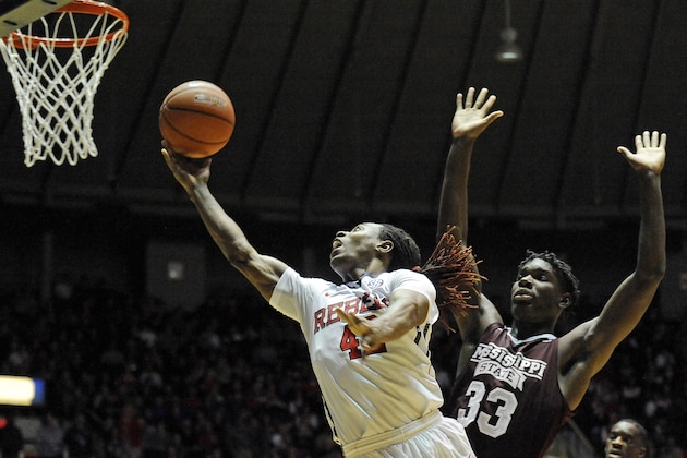 Mississippi guard Stefan Moody (42) shoots past Mississippi State forward Oliver Black (33) during the second half of an NCAA college basketball game in Oxford, Miss., Wednesday, Jan. 28, 2015. Mississippi won 79-73. (AP Photo/Thomas Graning)
