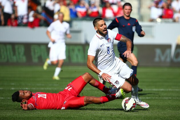 LOS ANGELES, CA - FEBRUARY 08:  Anibal Godoy #20 of Panama tackles Clint Dempsey #8 of the USA in the second half of ther international men's friendly match at StubHub Center on February 8, 2015 in Los Angeles, California. The USA defeated Panama 2-0.  (Photo by Victor Decolongon/Getty Images)