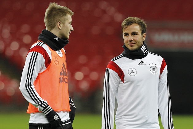 LONDON, ENGLAND - NOVEMBER 18: Marco Reus and Mario Goetze of Germany warm up during a training session at Wembley Stadium ahead of their International Friendly against England on November 18, 2013 in London, England. (Photo by Charlie Crowhurst/Getty Images)