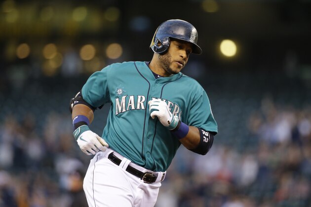 Seattle Mariners' Robinson Cano rounds the bases against the Oakland Athletics in a baseball game, Friday, Sept. 12, 2014, in Seattle. (AP Photo/Ted S. Warren)