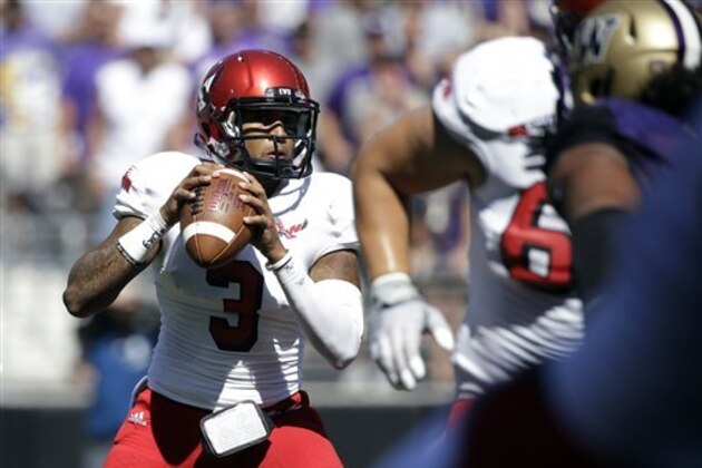 Eastern Washington quarterback Vernon Adams Jr. throws against Washington Huskies in the second half of an NCAA football game Saturday, Sept. 6, 2014, in Seattle. Washington won 59-52. (AP Photo/Elaine Thompson)