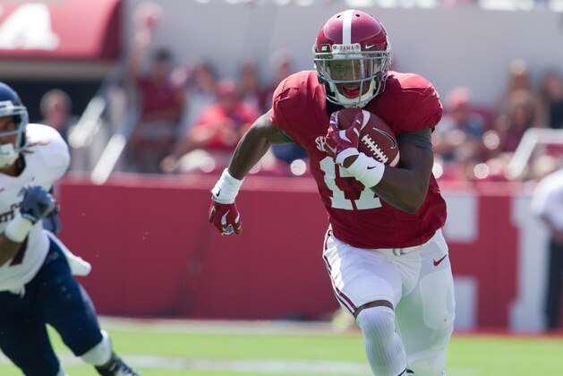 Sep 6, 2014; Tuscaloosa, AL, USA; Alabama Crimson Tide running back Kenyan Drake (17) carries the ball against the Florida Atlantic Owls at Bryant-Denny Stadium. Mandatory Credit: Marvin Gentry-USA TODAY Sports
