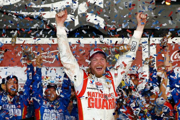 DAYTONA BEACH, FL - FEBRUARY 23:  Dale Earnhardt Jr., driver of the #88 National Guard Chevrolet, celebrates in Victory Lane after winning the NASCAR Sprint Cup Series Daytona 500 at Daytona International Speedway on February 23, 2014 in Daytona Beach, Florida.  (Photo by Tom Pennington/Getty Images)