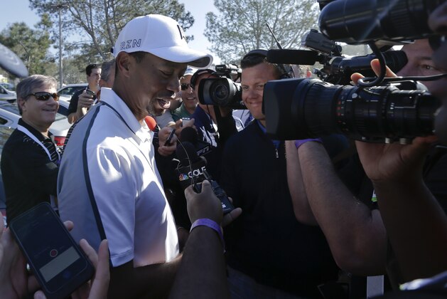 Tiger Woods speaks to reporters after withdrawing during the first round of the Farmers Insurance Open golf tournament Thursday, Feb. 5, 2015, in San Diego. (AP Photo/Gregory Bull)