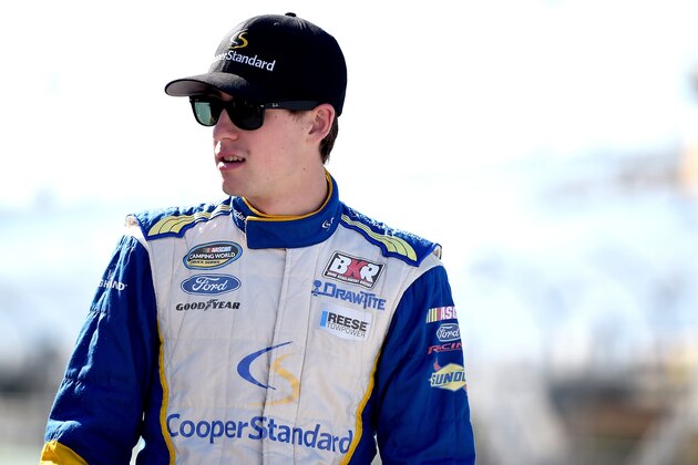 HOMESTEAD, FL - NOVEMBER 14:  Ryan Blaney, driver of the #29 Cooper Standard Ford, stands on the grid during qualifying for the NASCAR Camping World Truck Series Ford EcoBoost 200 at Homestead-Miami Speedway on November 14, 2014 in Homestead, Florida.  (Photo by Patrick Smith/Getty Images)