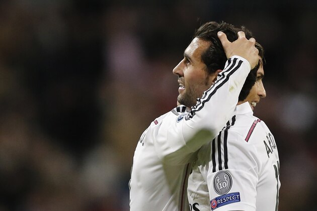 Real Madrid's Alvaro Arbeloa celebrates scoring his side's 3rd goal with Cristiano Ronaldo during a Group B Champions League soccer match between Real Madrid and Ludogorets at the Santiago Bernabeu stadium in Madrid, Spain, Tuesday Dec. 9, 2014. (AP Photo/Daniel Ochoa de Olza)