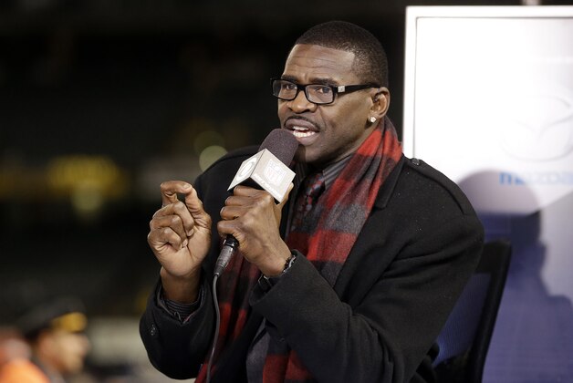 Michael Irvin sits on the NFL Network Thursday Night Football post-game set in O.co Coliseum after an NFL football game between the Oakland Raiders and the Kansas City Chiefs in Oakland, Calif., Thursday, Nov. 20, 2014. (AP Photo/Ben Margot)