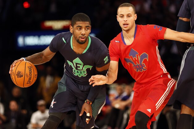 Feb 16, 2014; New Orleans, LA, USA; Eastern Conference Kyrie Irving guard (2) of the Cleveland Cavaliers dribbles around Western Conference guard Stephen Curry (30) of the Golden State Warriors during the 2014 NBA All-Star Game at the Smoothie King Center. Mandatory Credit: Derick E. Hingle-USA TODAY Sports