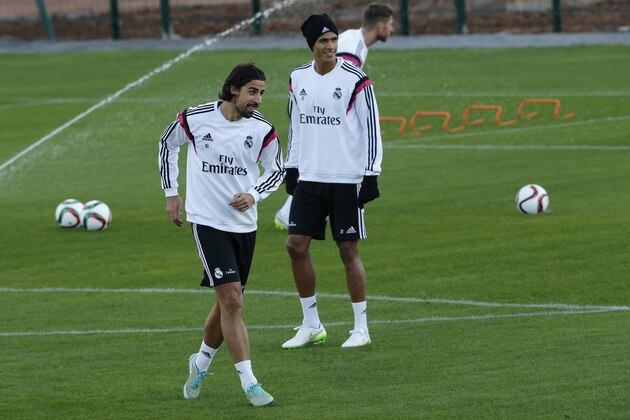 Real Madrid's Sami Khedira, left, and Raphael Varane attend a training session at the Club World Cup soccer tournament in Rabat, Morocco, Monday, Dec. 15, 2014. Real Madrid will play against Cruz Azul in their semifinal in Marrakech on Tuesday. (AP Photo/Abdeljalil Bounhar)