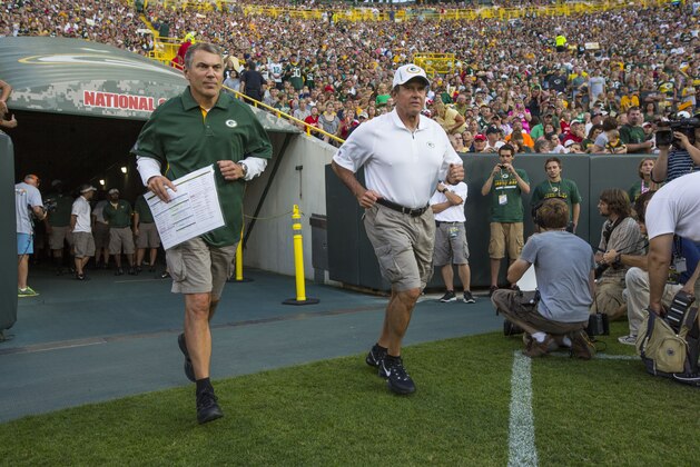 Packers offensive coordinator Tom Clements and defensive coordinator Dom Capers during  the Packers NFL football intrasquad scrimmage Friday, Aug. 3, 2012, in Green Bay, Wis. (AP Photo/Mike Roemer)