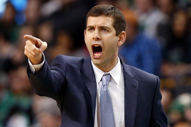Boston Celtics coach Brad Stevens gestures during the second half of the Celtics' 107-96 win over the Philadelphia 76ers in an NBA basketball game in Boston on Friday, Feb. 6, 2015. (AP Photo/Winslow Townson)
