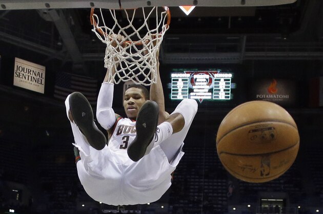 Milwaukee Bucks' Giannis Antetokounmpo dunks during the second half of an NBA basketball game against the Sacramento Kings on Wednesday, Feb. 11, 2015, in Milwaukee. (AP Photo/Morry Gash)