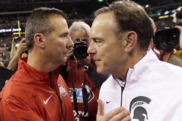 FILE - In this Dec. 7, 2013, file photo, Michigan State head coach Mark Dantonio, right, is congratulated by Ohio State head coach Urban Meyer following the Big Ten Conference championship NCAA college football game in Indianapolis. After beating up on lesser opponents for six straight games, No. 13 Ohio State gets to see just how good it is. Up next, No. 7 Michigan State. (AP Photo/AJ Mast, File)