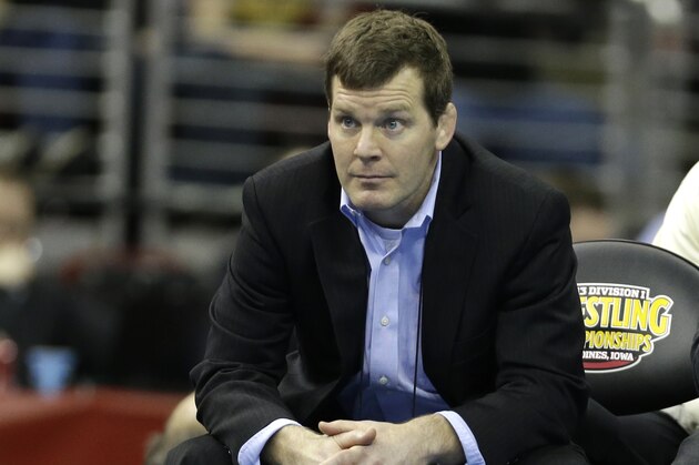 Iowa wrestling coach Tom Brands looks on during the 157-pound championship match between Iowa's Derek St. John and Northwestern's Jason Welch at the NCAA Division I wrestling championships, Saturday, March 23, 2013, in Des Moines, Iowa. (AP Photo/Charlie Neibergall)