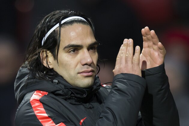 Manchester United's Radamel Falcao applauds supporters after the English Premier League soccer match between Manchester United and Leicester at Old Trafford Stadium, Manchester, England, Saturday Jan. 31, 2015. (AP Photo/Jon Super)