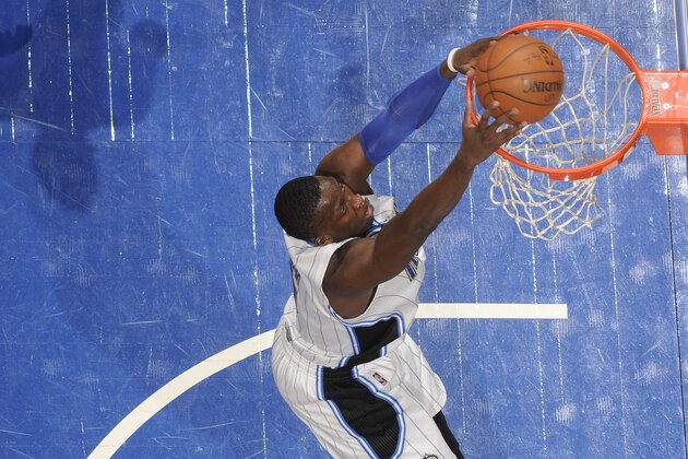 ORLANDO, FL - JANUARY 16:  Victor Oladipo #5 of the Orlando Magic dunks against the Memphis Grizzlies on January 16, 2015 at Amway Center in Orlando, Florida. NOTE TO USER: User expressly acknowledges and agrees that, by downloading and or using this photograph, User is consenting to the terms and conditions of the Getty Images License Agreement. Mandatory Copyright Notice: Copyright 2015 NBAE (Photo by Fernando Medina/NBAE via Getty Images)