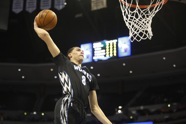 Jan 17, 2015; Denver, CO, USA; Minnesota Timberwolves guard Zach LaVine (8) dunks the ball during the second half against the Denver Nuggets at Pepsi Center. The Timberwolves won 113-105. Mandatory Credit: Chris Humphreys-USA TODAY Sports
